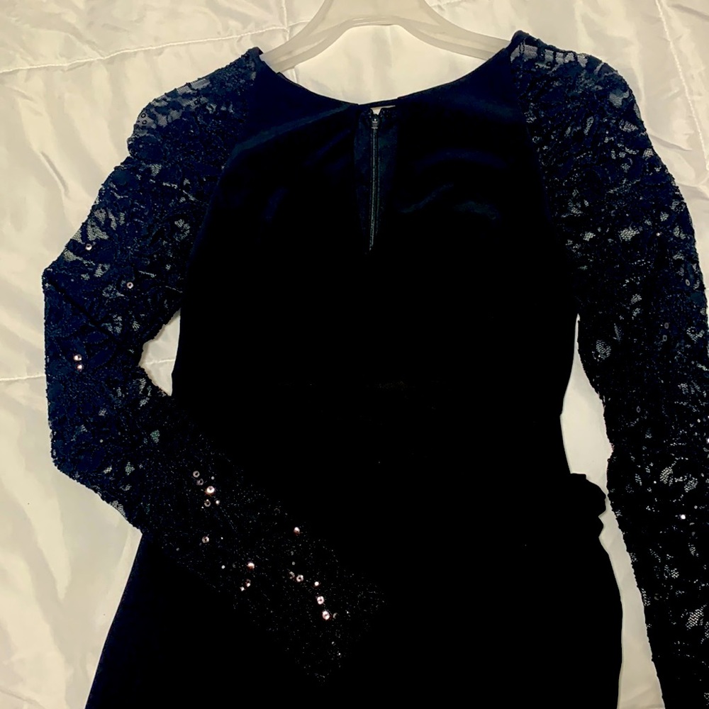 Formal black Betsy Adam’s, with lower back slit.